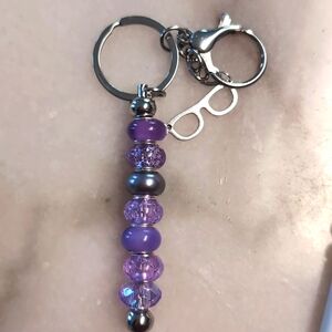 Purple keychain with sunglasses charm